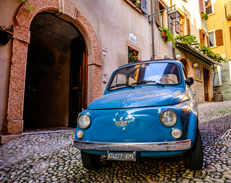 Malcesine, Italy - November 10: vintage car Fiat 500 at the old town of Malcesine on November 10, 2022