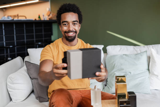 istock A young multiracial man is shooting a video at home. Personal perspective. 1470570709