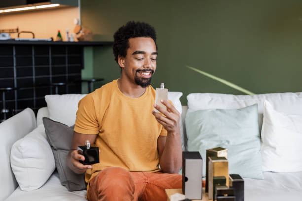 istock An attractive young man at home choosing a perfume 1470570710