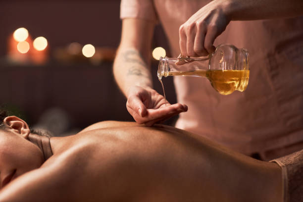 istock Masseuse Applying Oil on Back 1470570797