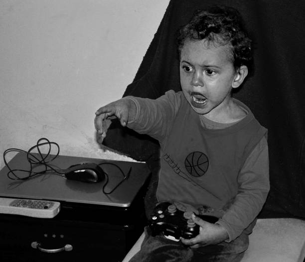 istock Boy - Video Game - Home - Black And White 1470570803