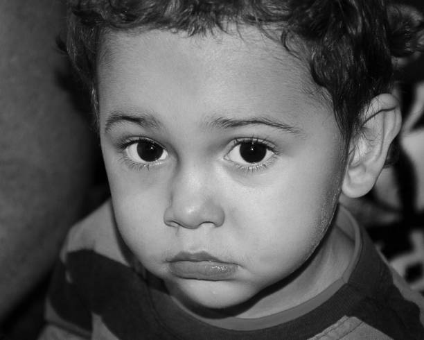 istock Portrait - Young Boy - Close-Up - Black And White 1470570893