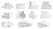 Set of folded and rolled towels on white background