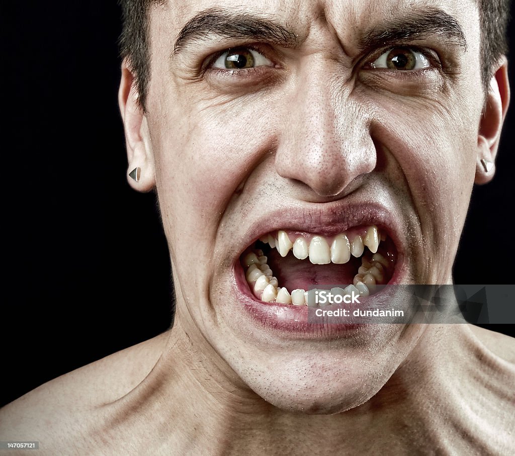 Grimace of angry furious stressed man Stress concept - grimace of angry furious stressed man Ugliness Stock Photo