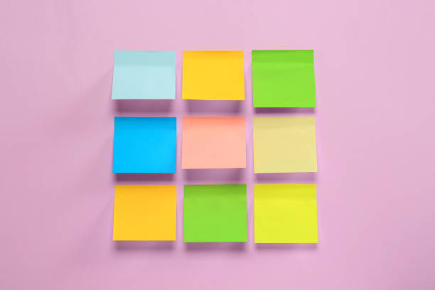 istock Blank colorful sticky notes on pink background, flat lay 1470571564