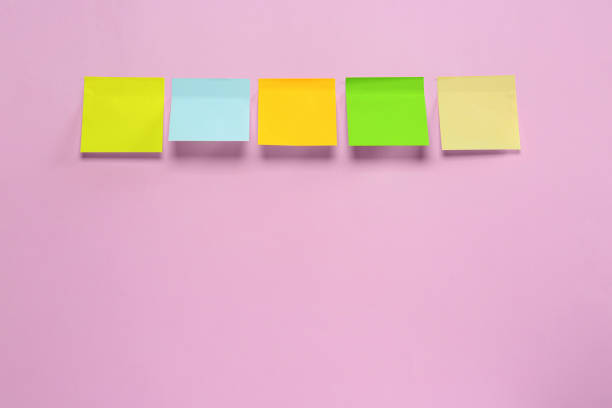 istock Blank colorful sticky notes on pink background, flat lay. Space for text 1470571598
