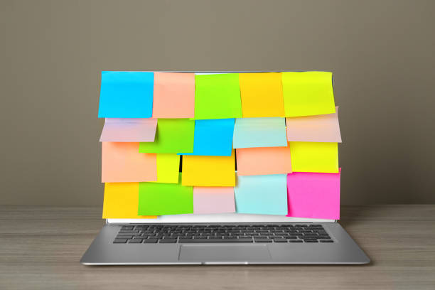 istock Laptop with colorful sticky notes on wooden table 1470571601