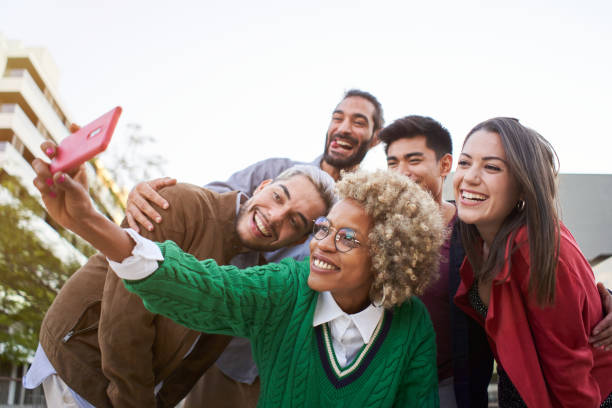 istock Multi ethnic students friends taking a smiling selfie. Happy millennial people using mobile phone. 1470571644