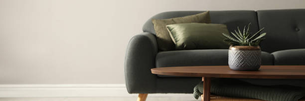 istock Stylish comfortable sofa in room, space for text. Banner design 1470572843