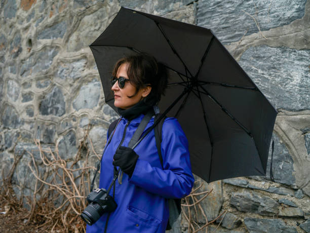 Cool woman with black umbrella