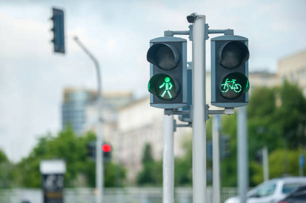 istock Pedestrian and bicycle traffic light on city street, space for text 1470574280