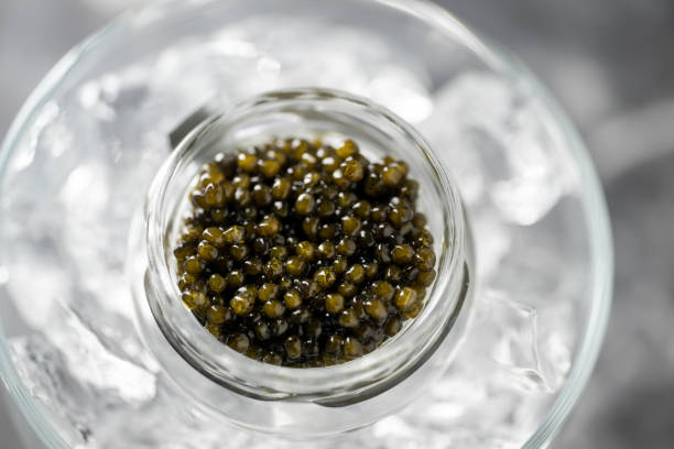 istock black caviar on ice with pearl spoon 1470574688