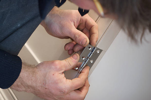 istock Carpenter Marking Out Section Prior To Fitting Door Hinge 147057749