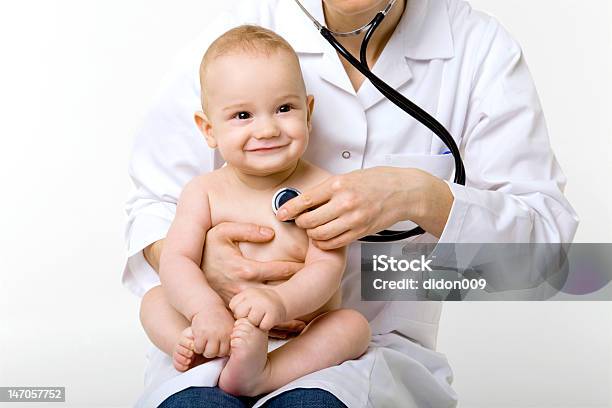 Doctor Examining Baby Stock Photo - Download Image Now - Pediatrician, Child, Doctor