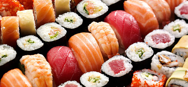 japanese sushi many tasty fresh japanese sushi with tuna, caviar and shrimp wasabi sauce stock pictures, royalty-free photos & images