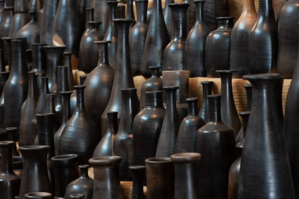 Black slim vases on the stand