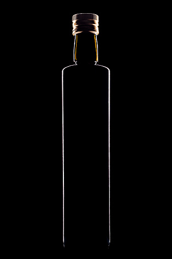Olive oil bottle silhouette on black background