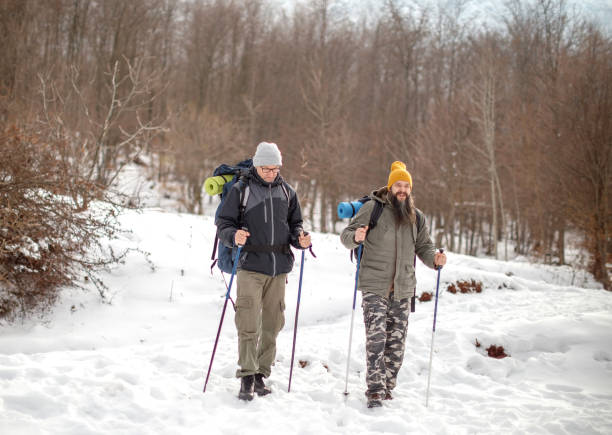 istock Two male friends hiking on snow 1470583784