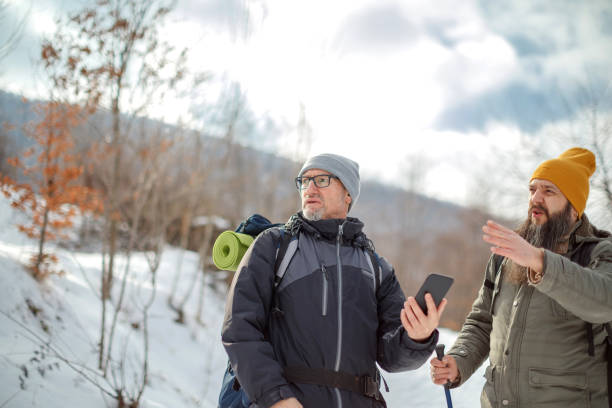 istock Two male friends hiking on snow 1470583924