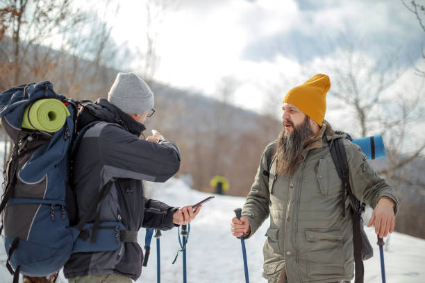 istock Two male friends hiking on snow 1470583937