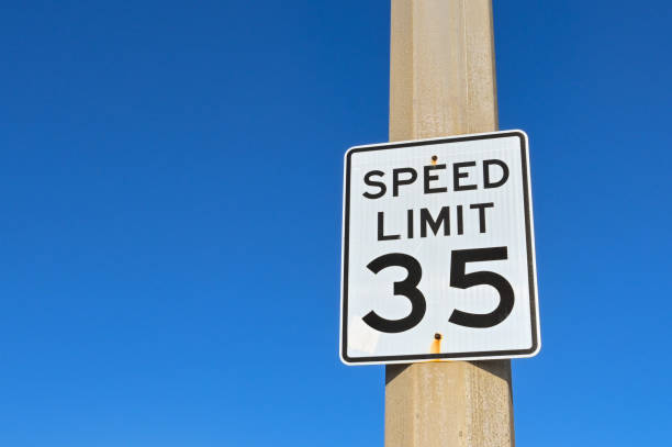 istock Speed limit sign against a blue sky 1470584502