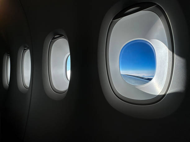 istock Row of windows inside a passenger jet cruising at altitude 1470584604
