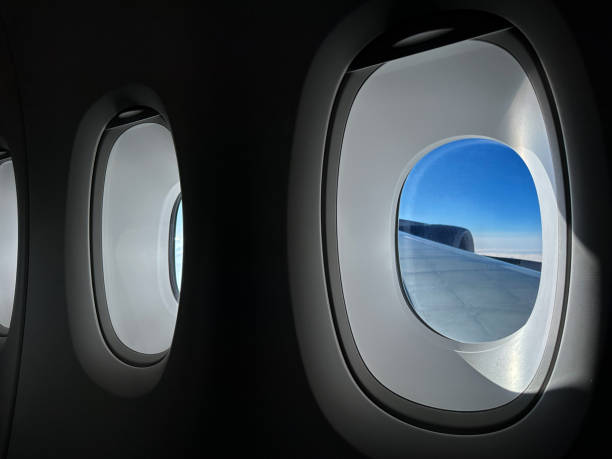 istock Row of windows inside a passenger jet cruising at altitude 1470584625