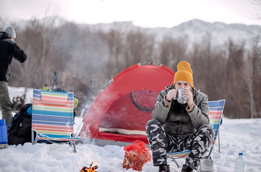 Healthy lifestyle with camping on mountain on snow during winter