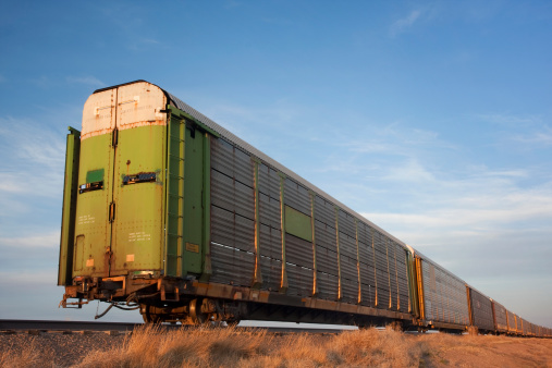 old double deck rail stock cars for livestock tranportation left on a sidetrack in Colorado prairie