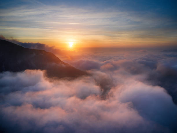 istock Beautiful sky over clouds at sunset time 1470585194