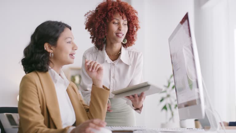 Business women, talking and technology in office financial insurance, finance budget planning or investment strategy. Smile, finance and workers on trading computer, tablet or teamwork collaboration