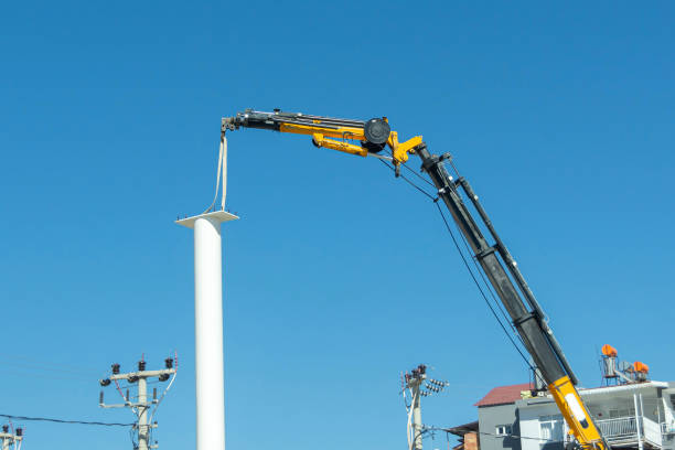 istock Installing a white pole support with a crane in the city. 1470587115