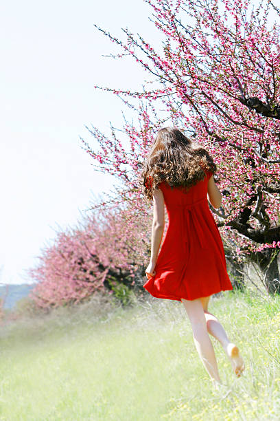 istock young girl in spring garden 147058721