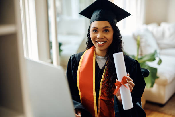 istock Happy African American graduate student showing her university certificate while looking at camera. 1470587225