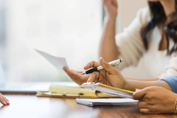 istock Close up photo of unrecognizeable person taking notes 1470588608