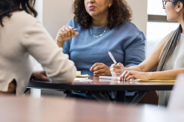 istock Low angle photo of employees taking notes 1470588628