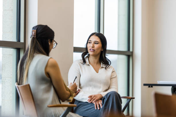 istock Distressed mid adult female talks with therapist 1470588630