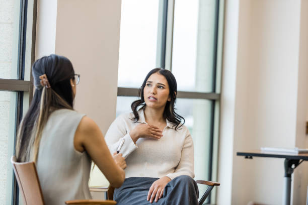 istock Worried female employee meets with supervisor 1470588636