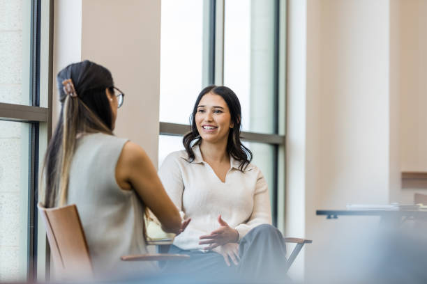 istock Female coworkers sit and enjoy conversation after work 1470588645