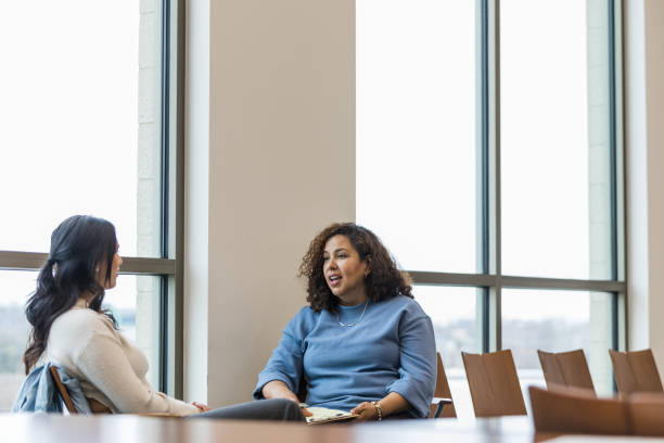 istock Mental health therapist talks with the female client about scheduling her next appointment 1470588653