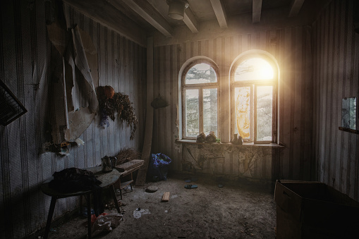 Dark creepy messy room in abandoned house
