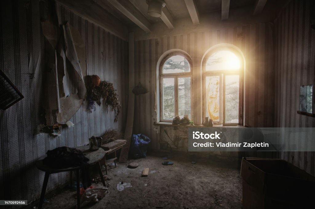 Dark creepy messy room in abandoned house Domestic Room Stock Photo