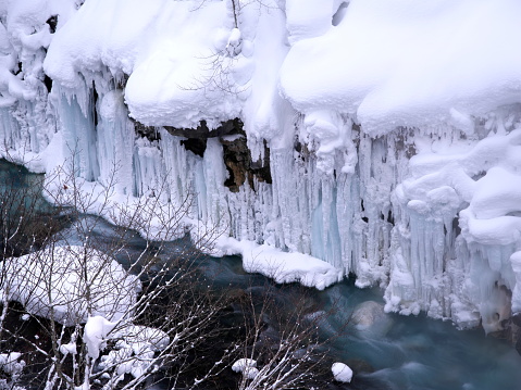 Hokkaido,Japan - February 26, 2023: Frozen Shirahige falls or Shirahige-no-taki Falls in Biei, Hokkaido, Japan
