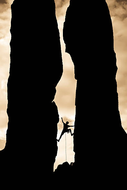 istock Rock climber reaching across a gap. 147059380
