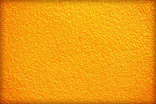 istock Gold or yellow paint on cement wall texture or backgrond 1470596817