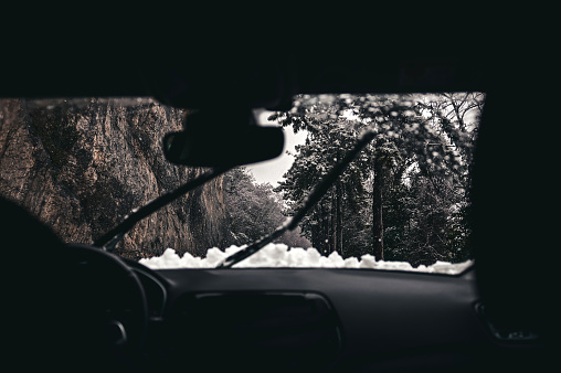 driving, car, winter, road, snow, ice, storm, windshield, car interior, snowing, cold temperature, country road, rear-view mirror, sleet, inside of, slippery, weather