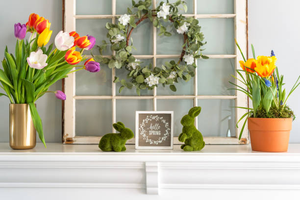 Hello Spring sign with tulips on the mantel stock photo