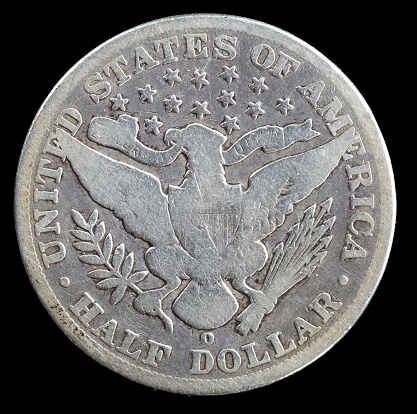 Reverse side of badly worn 1903 Barber Liberty Head half dollar minted in New Orleans.