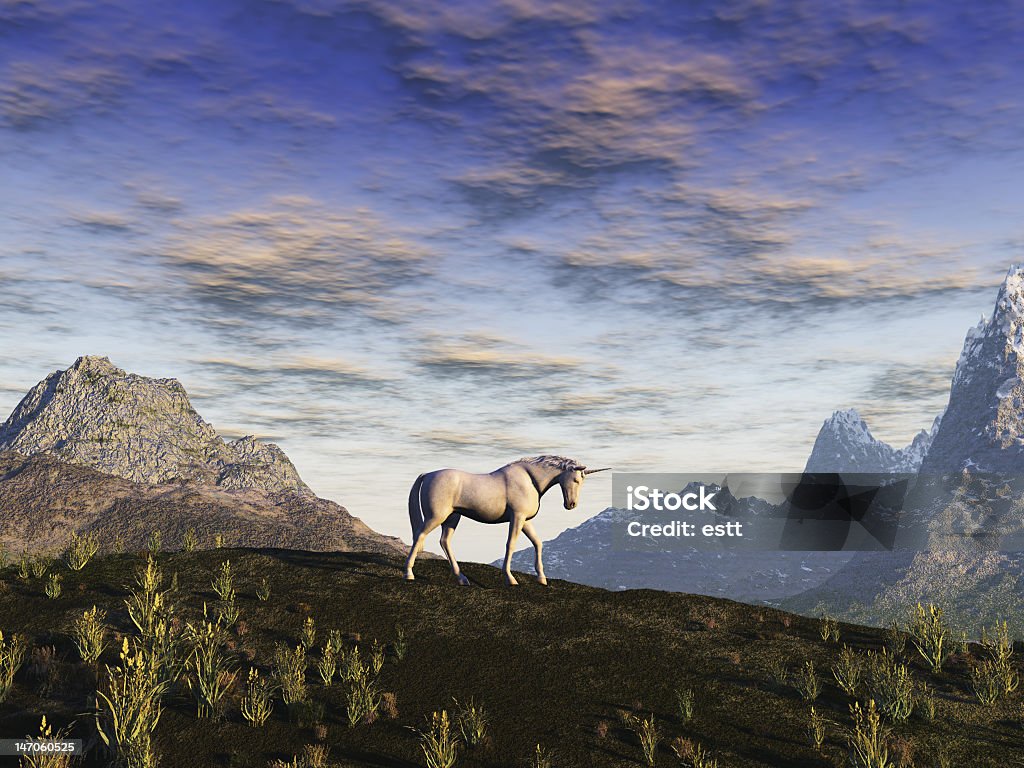 Lone unicorn in a field with mountains in the background Unicorn in a mountainous landscape Cloud - Sky Stock Photo