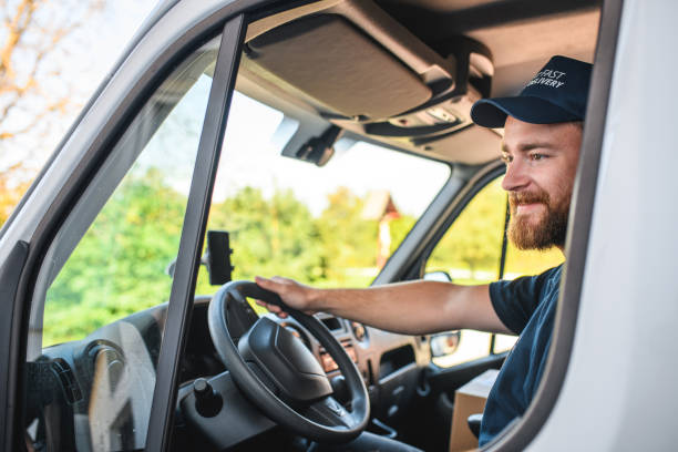 istock Young Delivery Man Sitting In Van Cockpit 1470608281